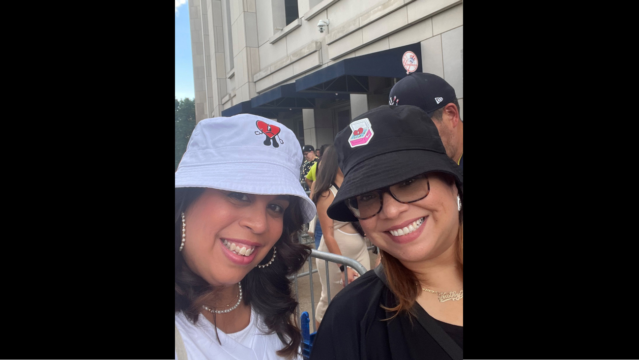 Two women wearing hats smiling