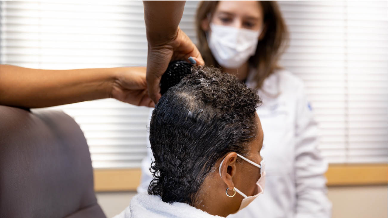 Woman getting hair loss treatment