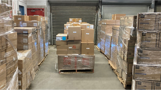 Supplies on shipping pallets ready to bring to the Dominican Republic.
