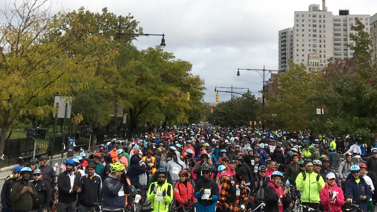 Racers and onlookers fill the street at the Tour de Bronx.