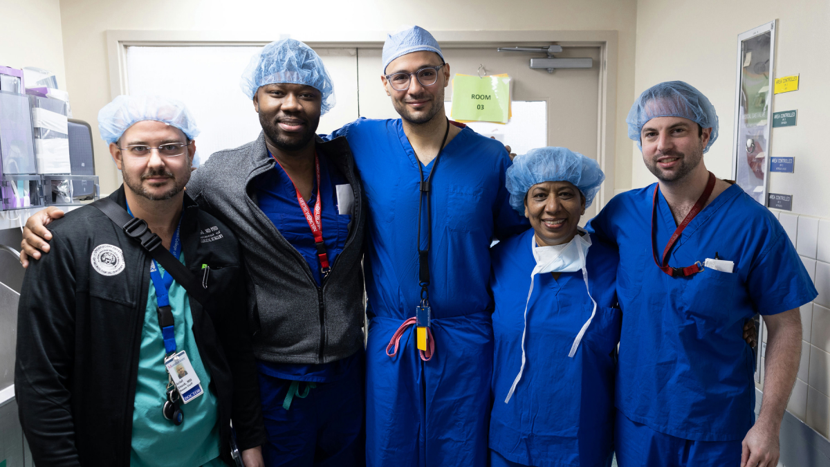 CHAM and Ukrainian doctors in scrubs pose for a group photo.