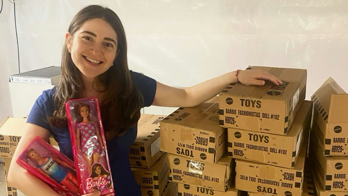 Photo of young woman with barbie dolls