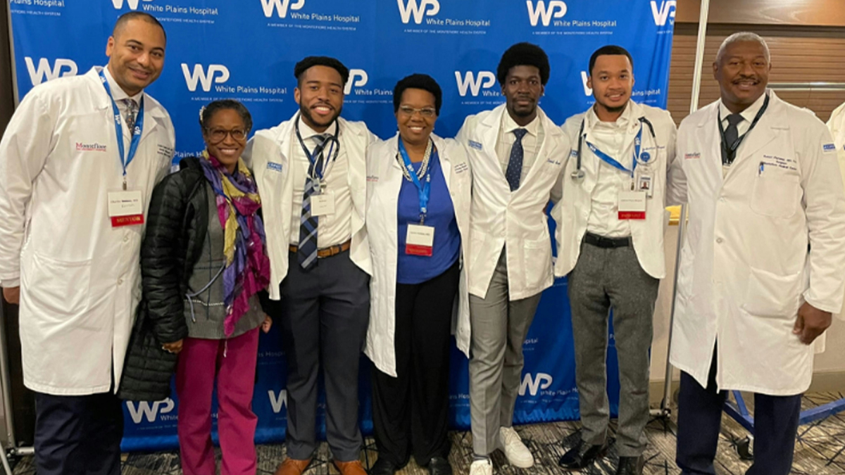 Photo of second annual black men in white coats youth summit