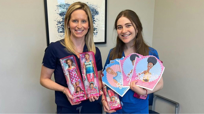 Two nurses with barbie dolls