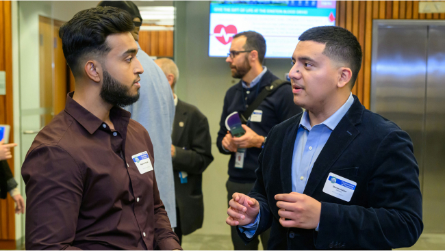 Photo of two men talking