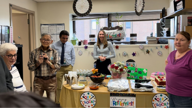 Dr. Gavora and her associates in a festive office.