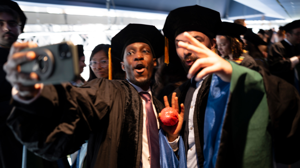 Two enthusiastic students pose for a picture.