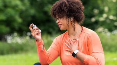 Woman with asthma inhaler