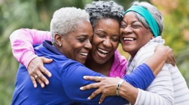 Three women hugging