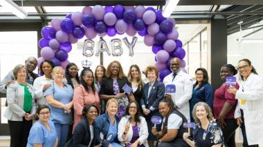 Doctors and staff of Montefiore Wakefield in front of a balloon arch.