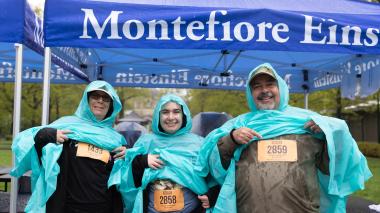 Rain-ready Bronx Zoo "Run for the Wild" participants show off their numbers.