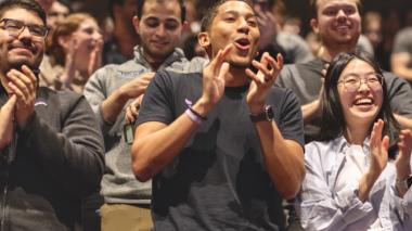 Students react enthusiastically to news of the gift of free tuition.