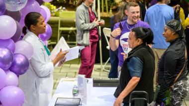 Attendees talk with staffers at the Montefiore Einstein Stroke Awareness event.